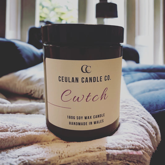 'Cwtch' soy wax amber jar candle.