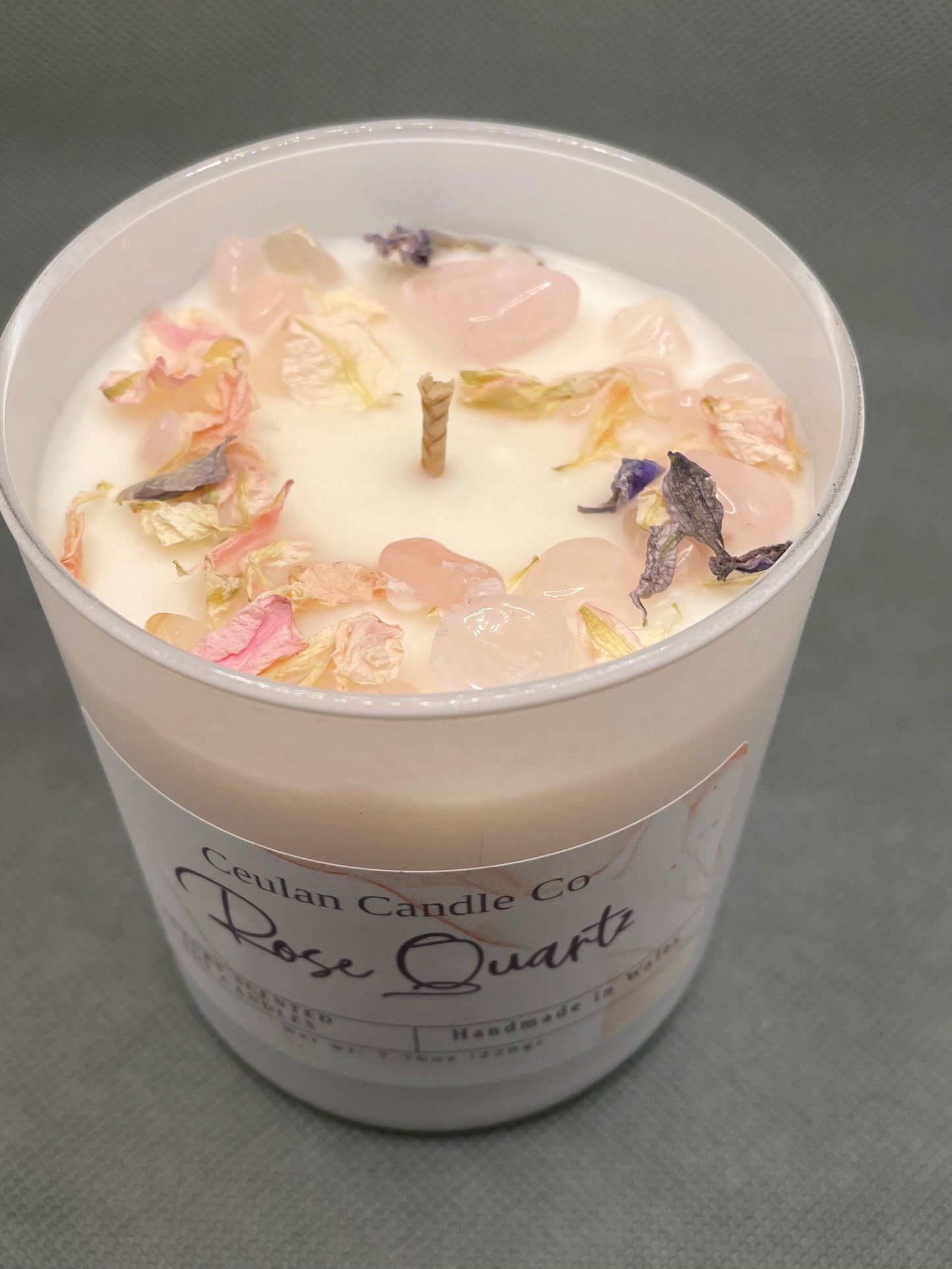 Rose Quartz soy wax candle with crystals & botanicals .