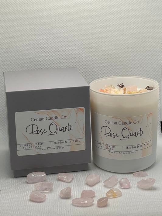 Rose Quartz soy wax candle with crystals & botanicals .